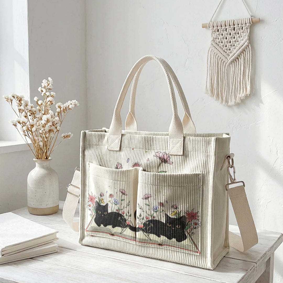 Sac à dos en velours côtelé rose avec impression de chat noir mignon et de livres, grande capacité et plusieurs poches pour les amoureux des chats, adapté pour les trajets domicile-travail.