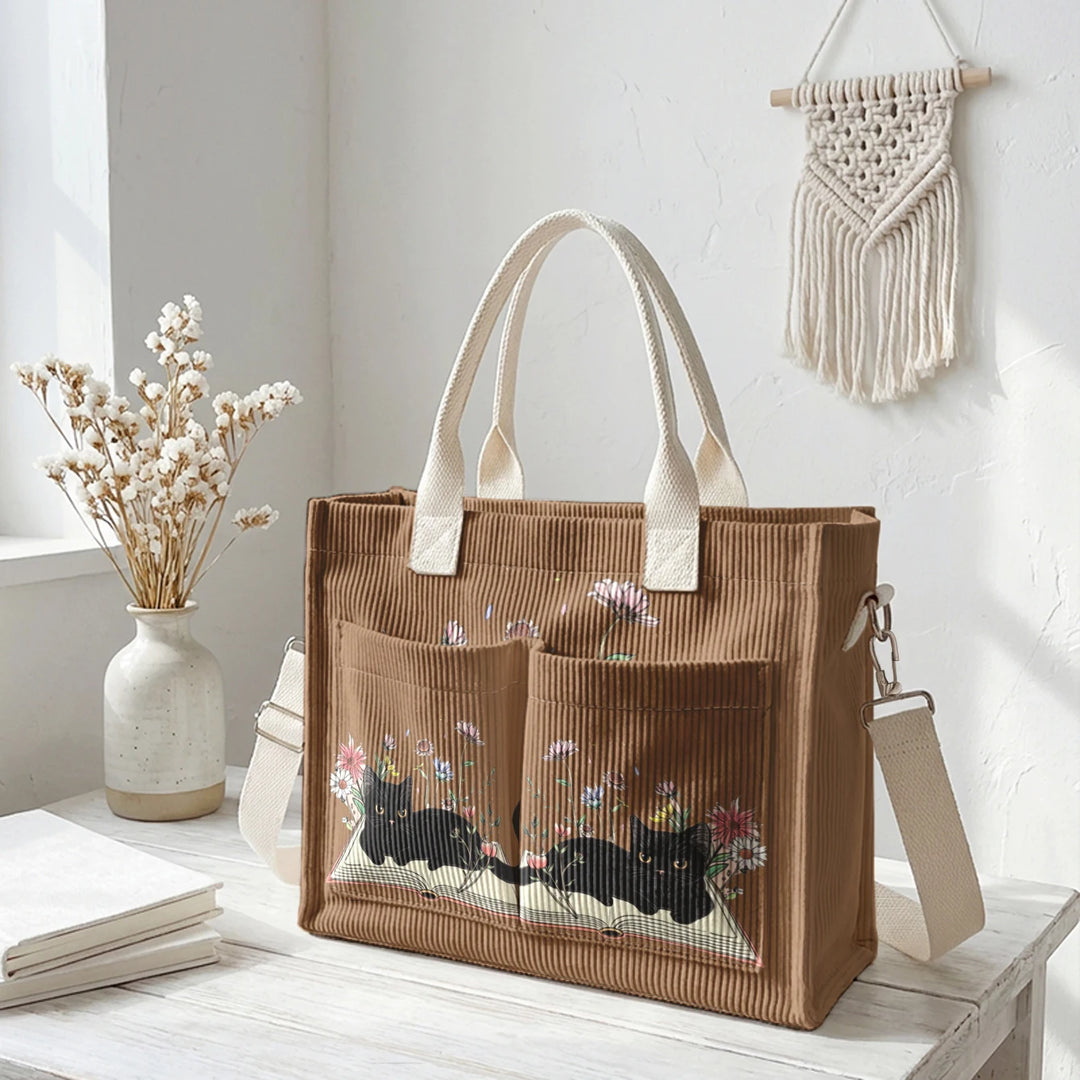 Sac à dos en velours côtelé rose avec impression de chat noir mignon et de livres, grande capacité et plusieurs poches pour les amoureux des chats, adapté pour les trajets domicile-travail.