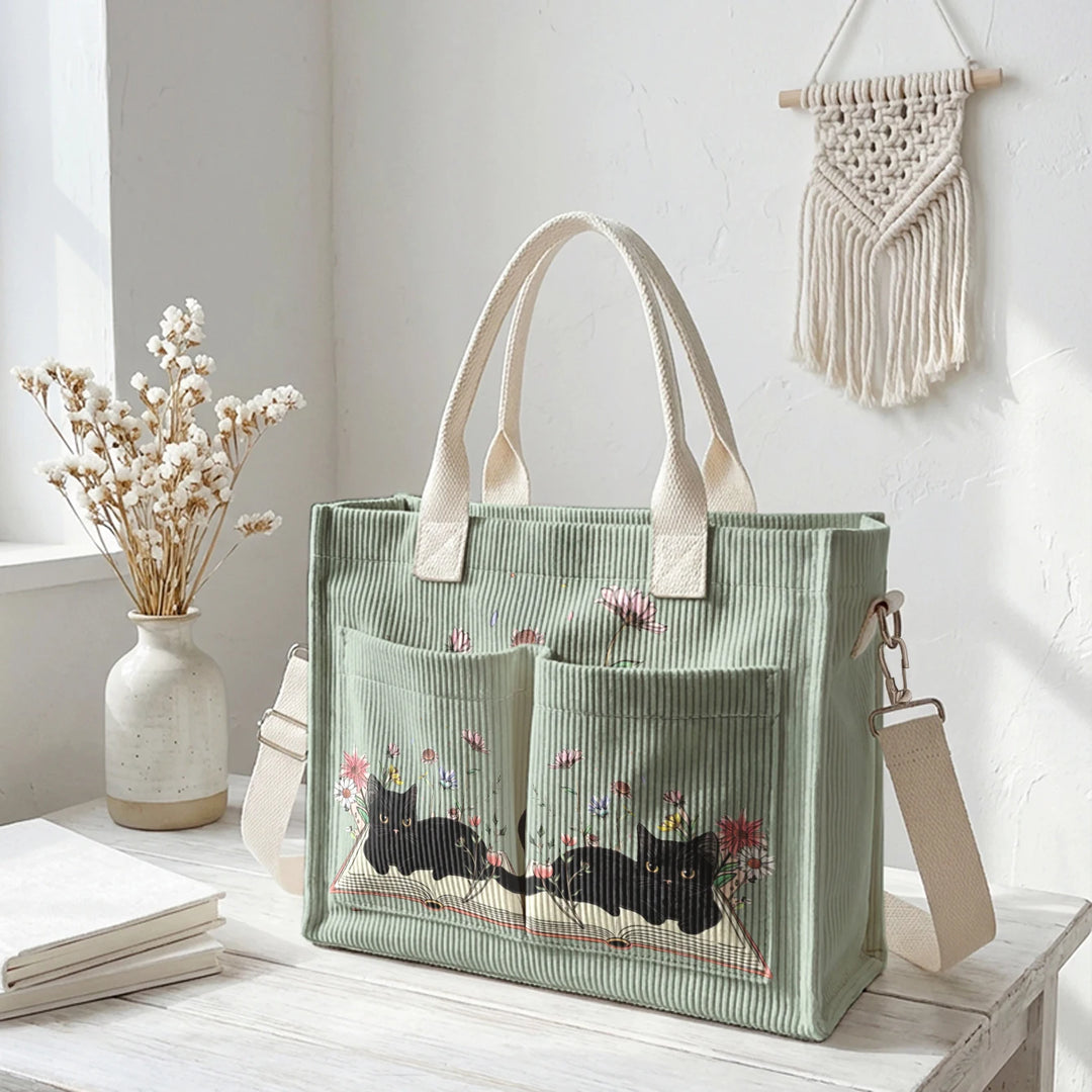 Sac à dos en velours côtelé rose avec impression de chat noir mignon et de livres, grande capacité et plusieurs poches pour les amoureux des chats, adapté pour les trajets domicile-travail.