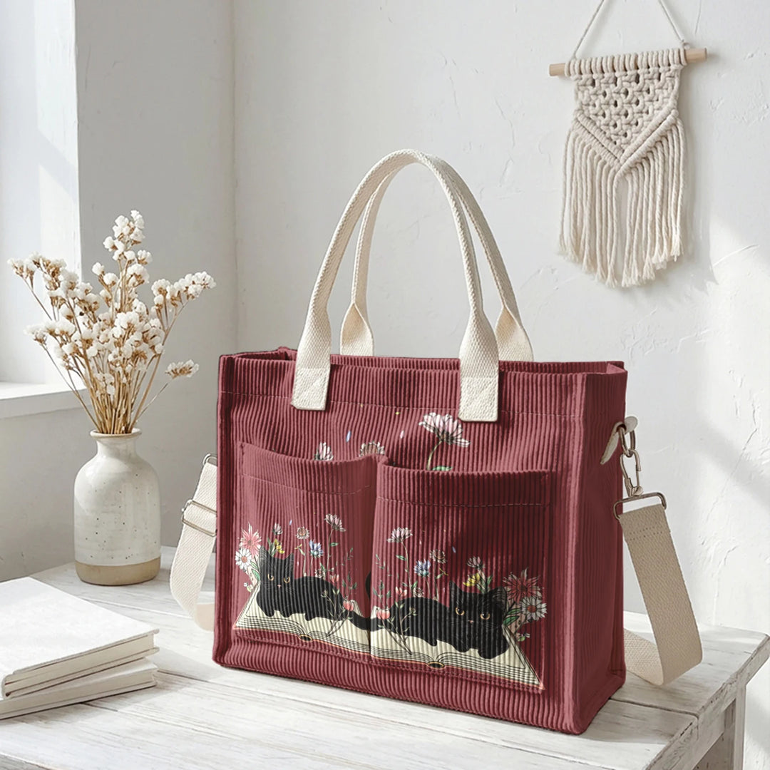 Sac à dos en velours côtelé rose avec impression de chat noir mignon et de livres, grande capacité et plusieurs poches pour les amoureux des chats, adapté pour les trajets domicile-travail.