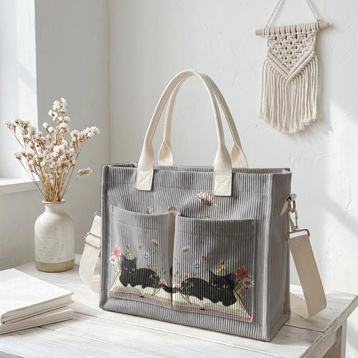 Sac à dos en velours côtelé rose avec impression de chat noir mignon et de livres, grande capacité et plusieurs poches pour les amoureux des chats, adapté pour les trajets domicile-travail.