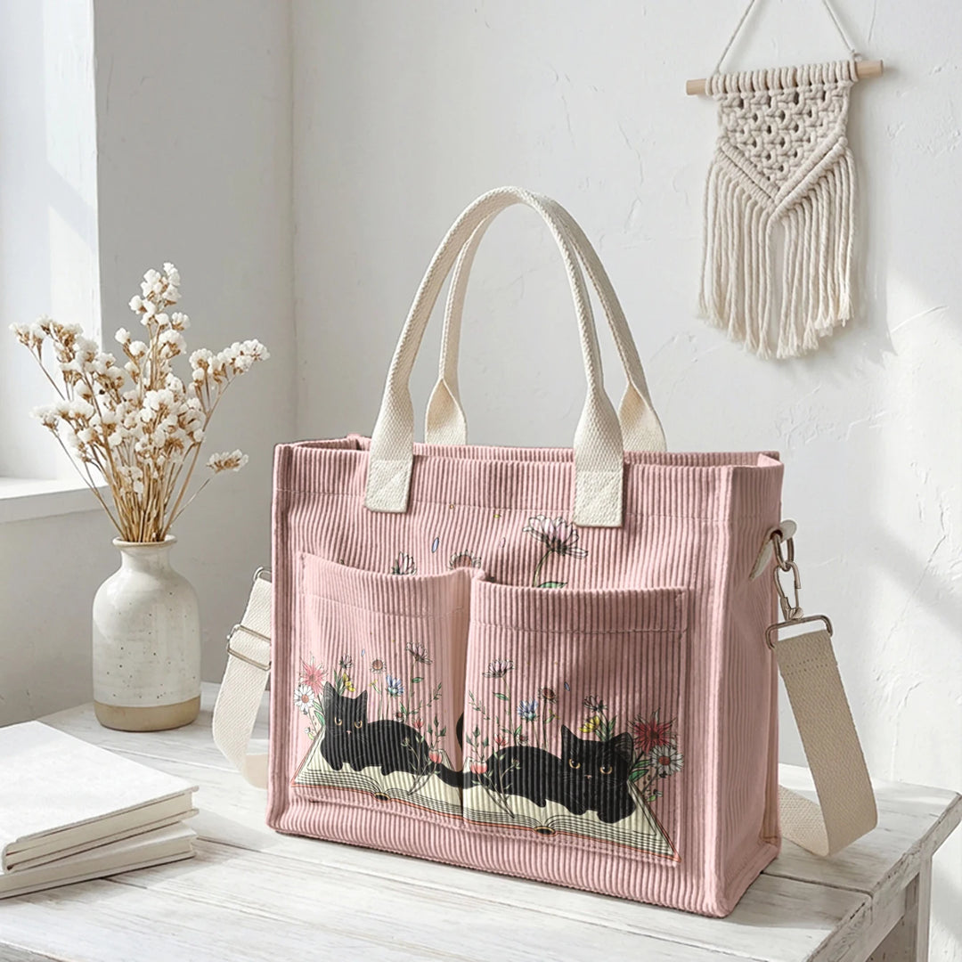 Sac à dos en velours côtelé rose avec impression de chat noir mignon et de livres, grande capacité et plusieurs poches pour les amoureux des chats, adapté pour les trajets domicile-travail.