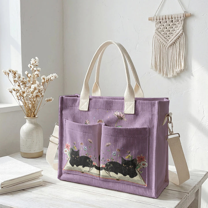 Sac à dos en velours côtelé rose avec impression de chat noir mignon et de livres, grande capacité et plusieurs poches pour les amoureux des chats, adapté pour les trajets domicile-travail.