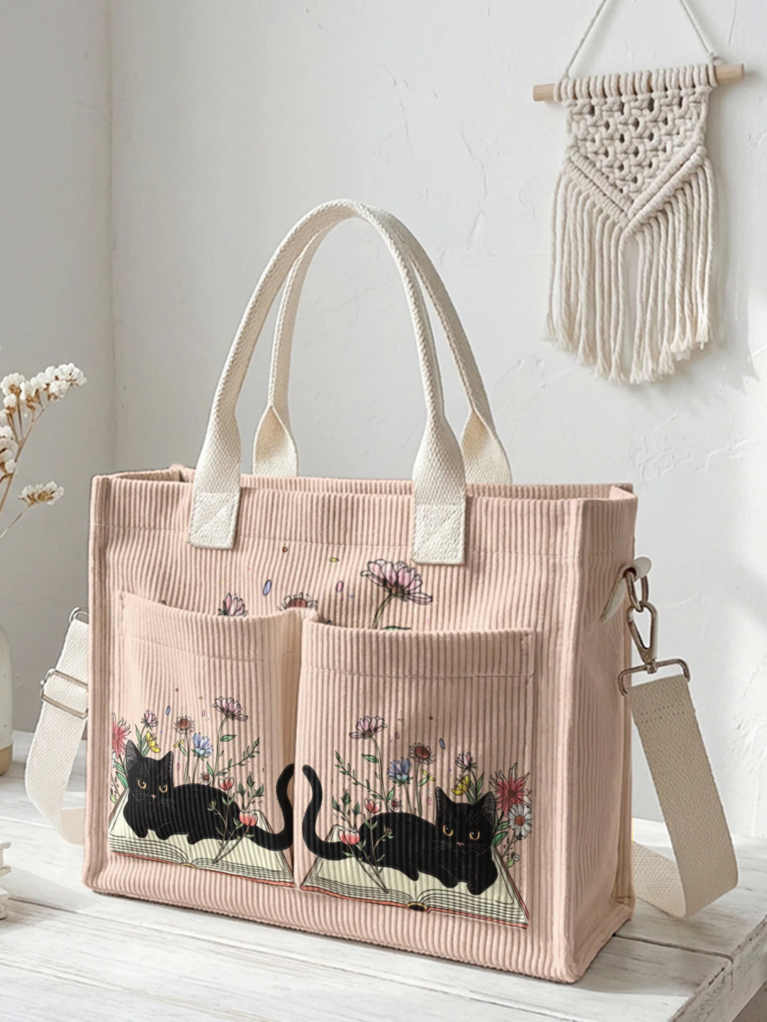 Sac à dos en velours côtelé rose avec impression de chat noir mignon et de livres, grande capacité et plusieurs poches pour les amoureux des chats, adapté pour les trajets domicile-travail.
