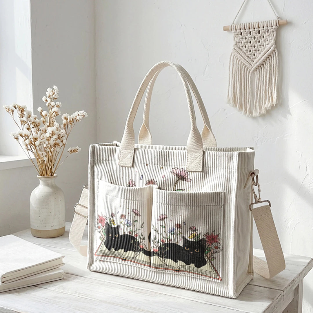 Sac à dos en velours côtelé rose avec impression de chat noir mignon et de livres, grande capacité et plusieurs poches pour les amoureux des chats, adapté pour les trajets domicile-travail.