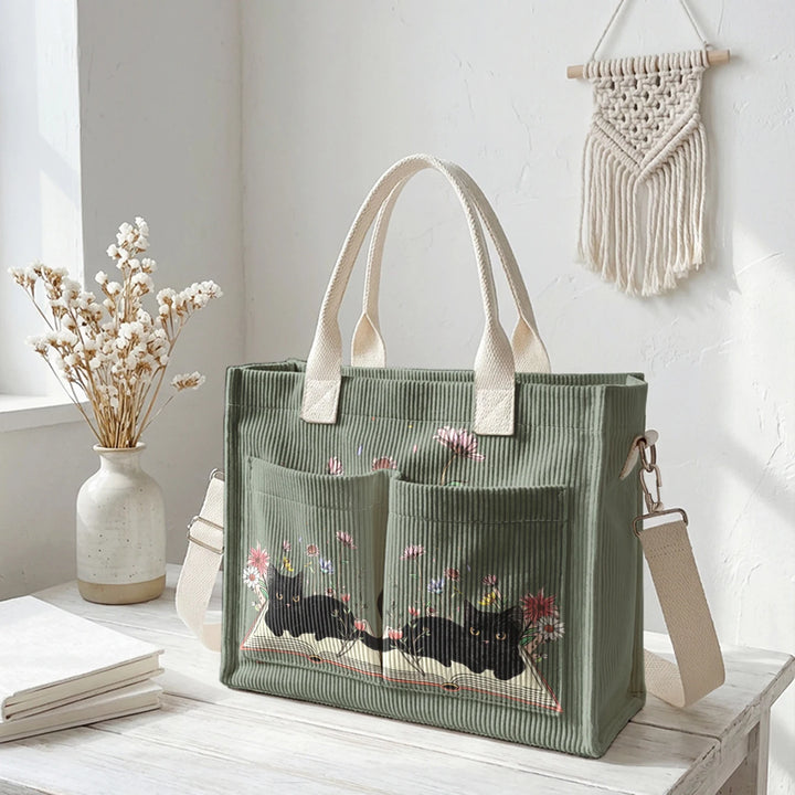 Sac à dos en velours côtelé rose avec impression de chat noir mignon et de livres, grande capacité et plusieurs poches pour les amoureux des chats, adapté pour les trajets domicile-travail.